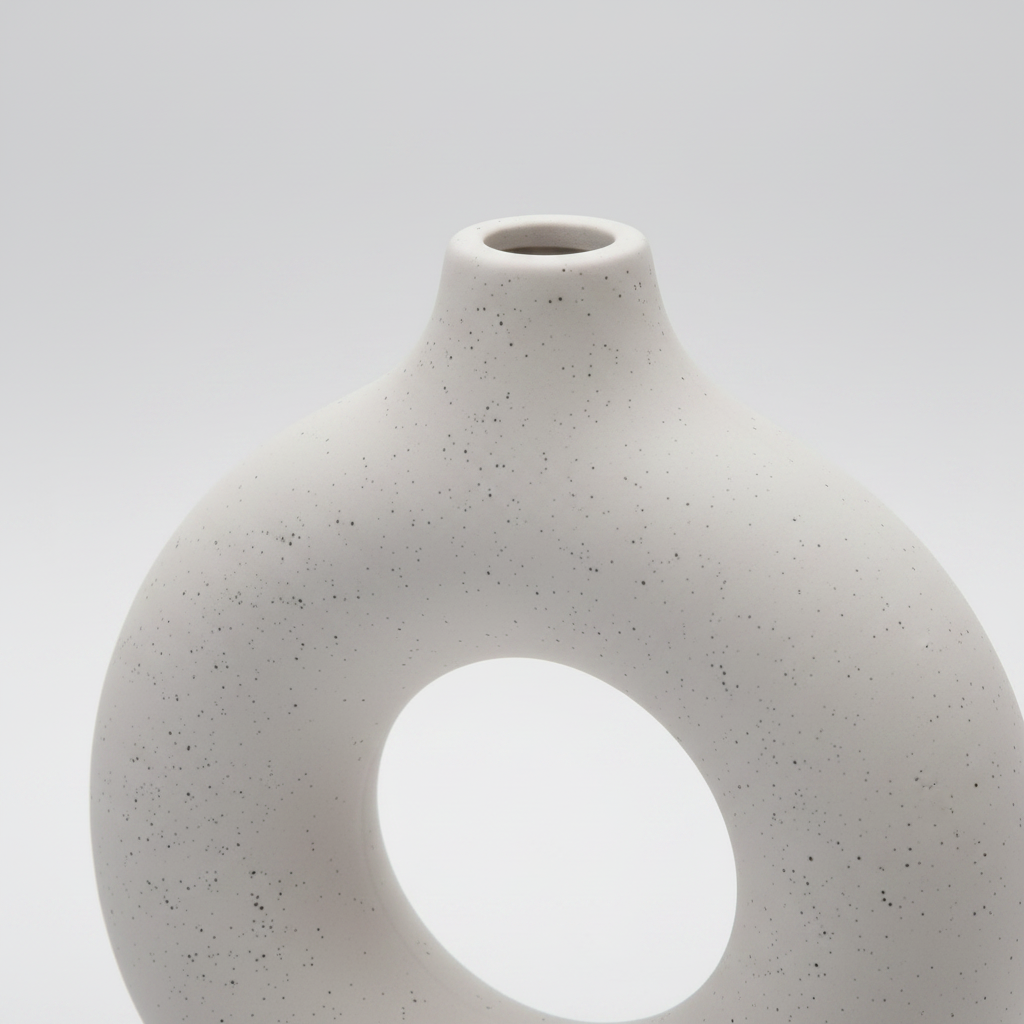 Close up detail of matte speckled ceramic vase texture