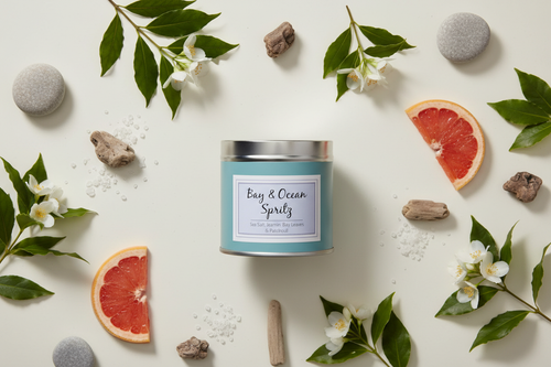 Bay & Ocean Spritz candle flat lay with bay leaves, jasmine, sea salt and grapefruit