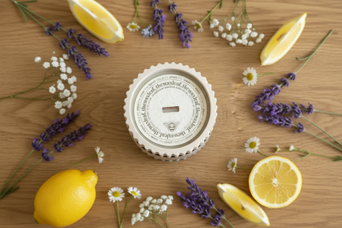 Bedtime Bliss candle flat lay with plantable wildflower seed cover, lavender and daisies