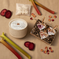 Black Plum & Rhubarb gift set flat lay with ceramic candle, wax melts and heart decorations