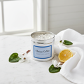 Classic Cotton white tin candle with silver crystal topping on marble surface