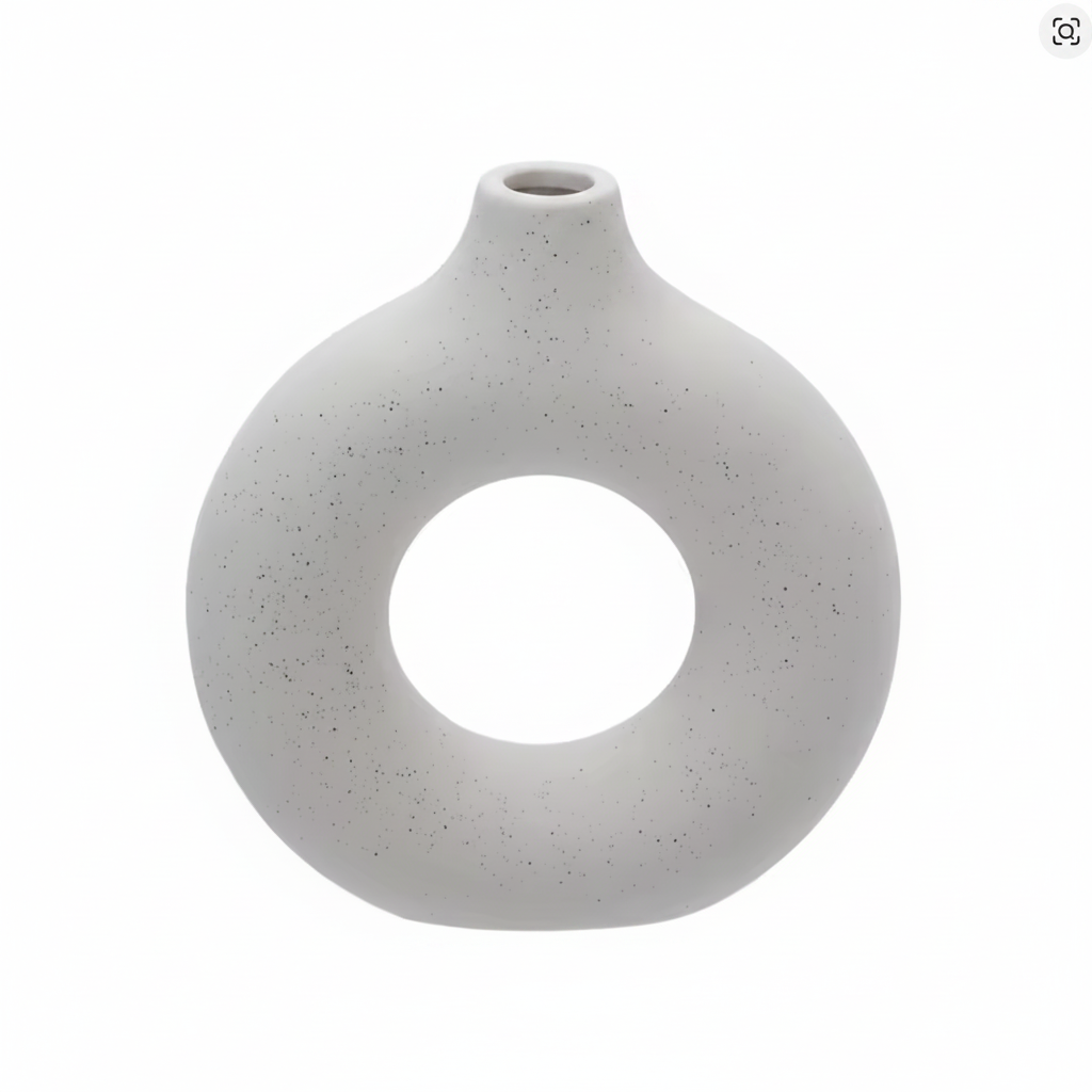White ceramic donut ring vase on white background